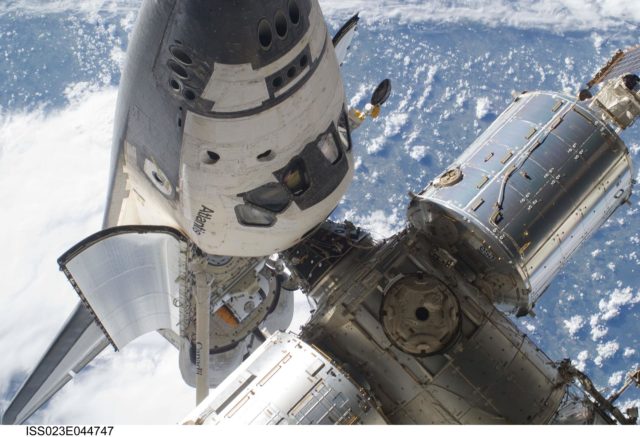 Space shuttle Atlantis docking with International Space Station